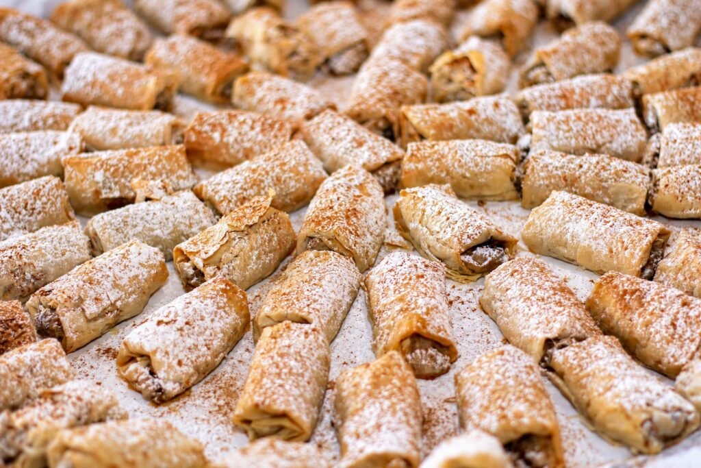 Close-up of pastries dusted with powdered sugar