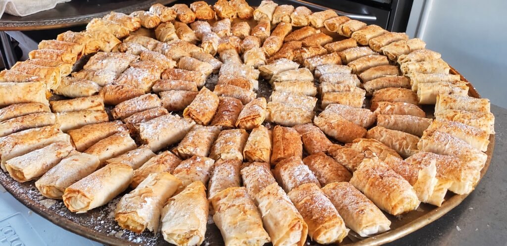 Large round platter of powdered-sugar pastries