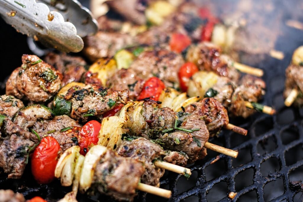 Meat and vegetable skewers on the grill