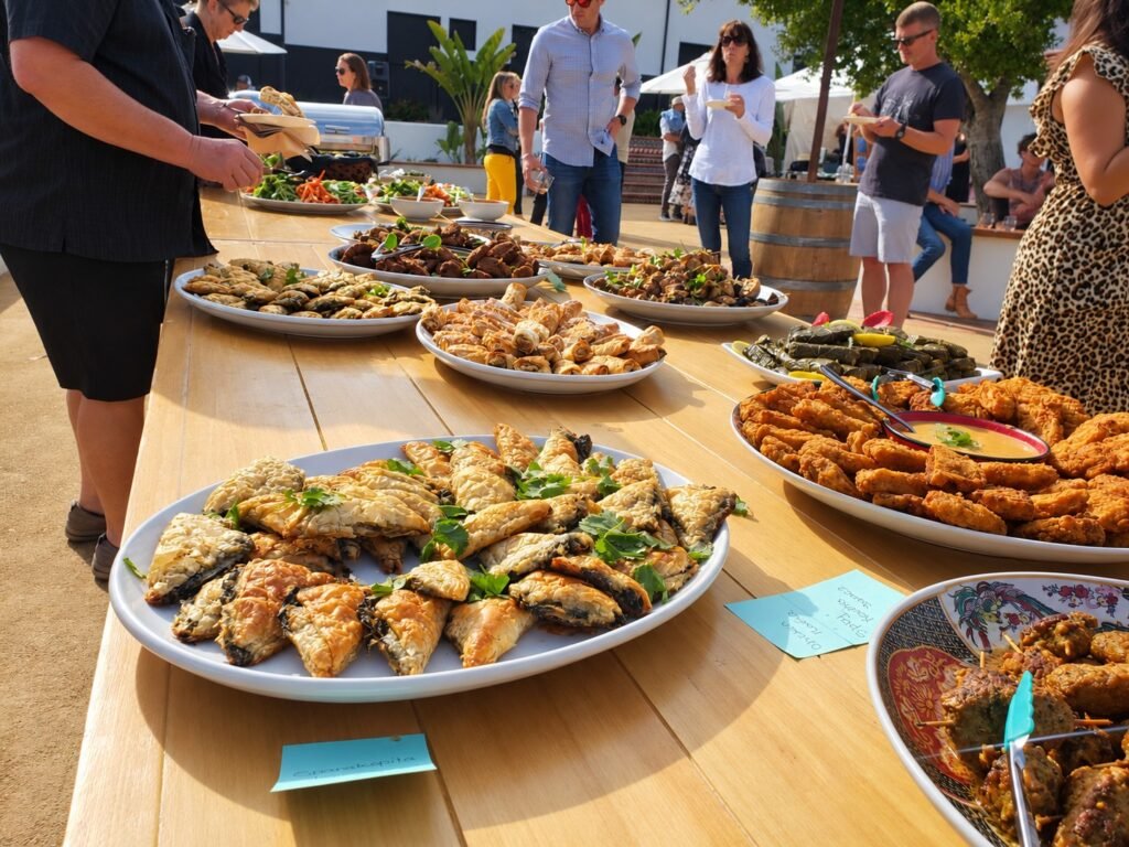 Outdoor appetizer buffet with pastries and savory bites