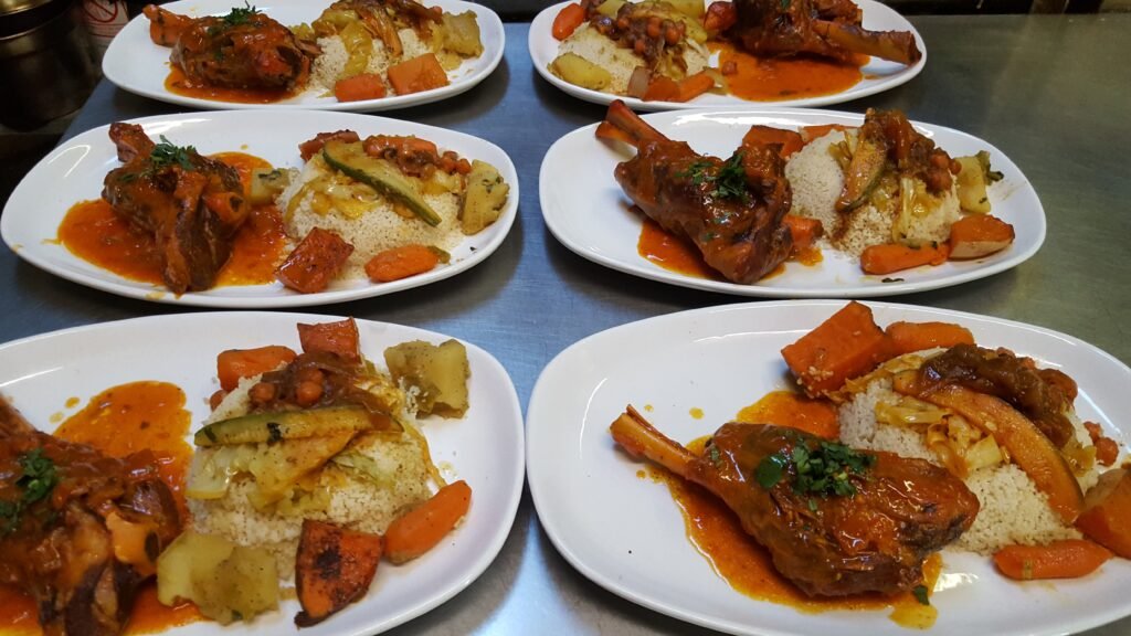Plated lamb with couscous and vegetables