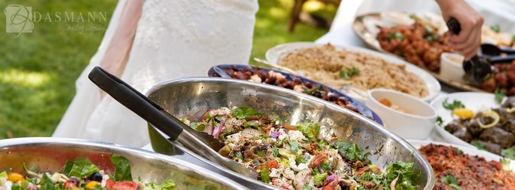 Salad bowls and serving platters at a wedding buffet